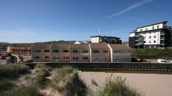 Exterior of villas and path to beach