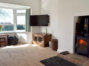 Comfortable and warm living room with wood burner | Wayside Cottage, North Frodingham, near Driffield