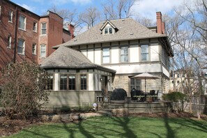 Back of home with deck and patio