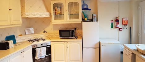 An immaculate kitchen with all you need to make a sumptuous meal.