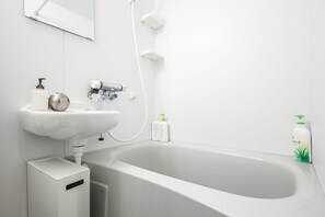 Take time to unwind with a deep soak in your private bath, complete with complimentary bath products