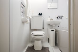 Fresh, private bathroom with toiletries, soft towels, and modern fixtures for a stress-free stay