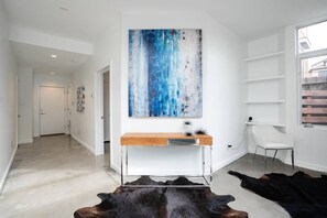 Inviting entry with view to rear garage entry.
