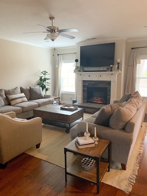 Living room with 2 full sofas and oversize chair