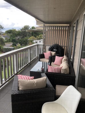 Front balcony with comfortable seats and new Weber Q 