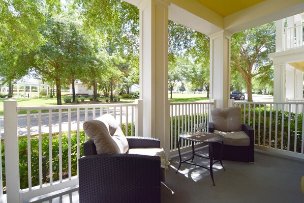 Beautiful balcony with comfortable seating and views to the community pool