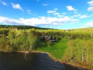 Aerial view of house - waterfront shown belongs to the property