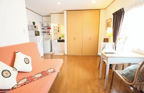 Open-plan design with warm lighting and smart storage solutions enhances comfort and convenience