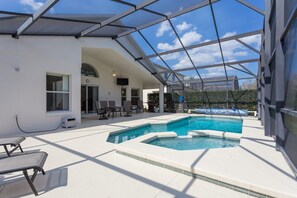 Large pool deck area with tv