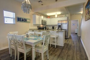 Dining area and kitchen located off of living area.