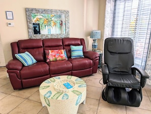 Comfy couch with two recliners and massage chair.