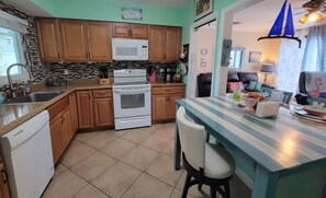 Fully equipped kitchen; stove, fridge, dishwasher, microwave. Dining area for #5