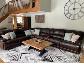 living room- large leather sectional with 3 reclining seats