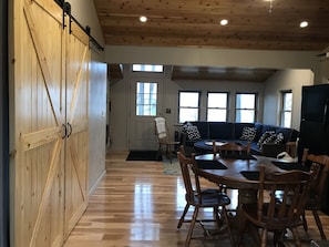 behind the barn doors are the bedrooms 