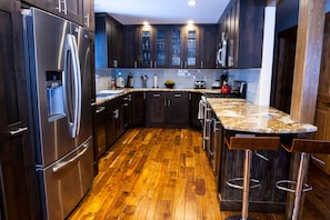 Well-equipped, gourmet custom kitchen has all you need to prepare meals