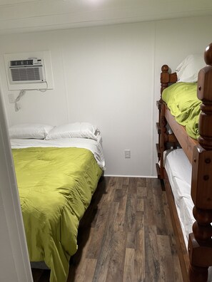 Bedroom with full size bed and bunks