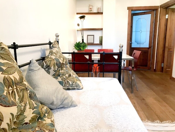 Living room and dining area. The bed can be opened and can fit 2 people.