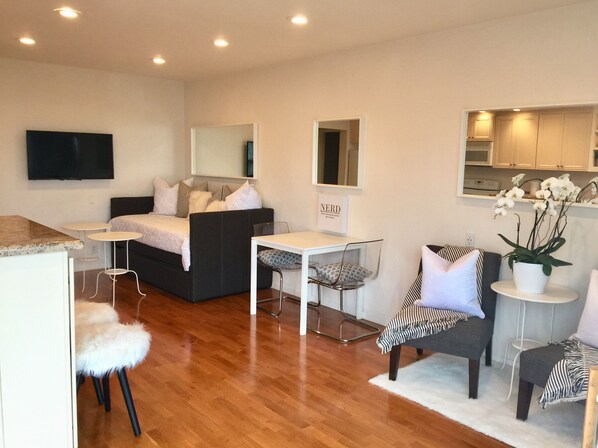Main Room: Daybed/Trundle, Kitchen Table & Chairs, Reading Chairs, TV & Kitchen