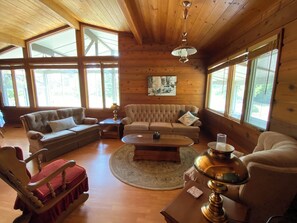 Expansive windows, vaulted ceilings. Pine, cedar throughout. Seats 10.