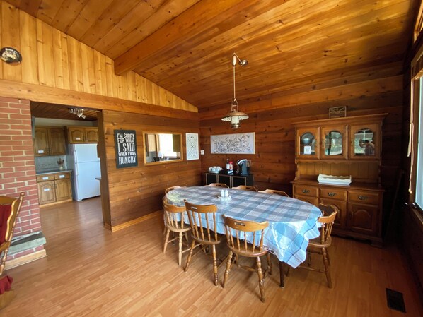 Open concept, bright natural light, spacious dining seating for 10. Extra dishes