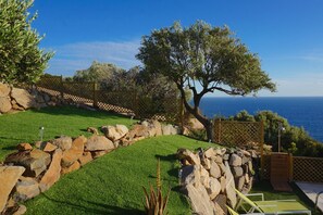 Tiered levels of the private back garden with sea views
