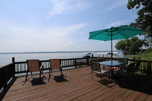 Sundeck overlooking the lake with dining seating for six.