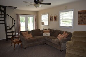 Living room, stairs to master, view of lake