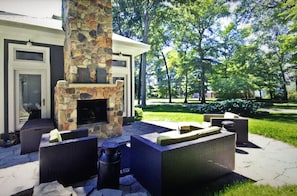 North patio with wood burning fireplace/fire feature