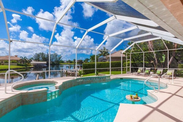 Southeastern facing pool area on a large gulf access canal
