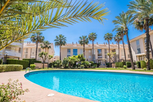 Communal Pool with beautifully manicured gardens