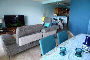 Spacious 20ft/6m wide living room has new 65" 4K UHD TV by Samsung.