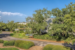 Beautiful setting adjacent to lagoon and neighborhood pool