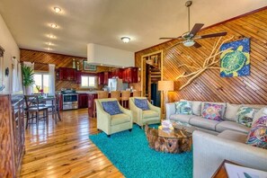 Large living room and kitchen area with high ceilings