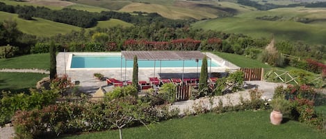 Pool with covered gazebo set in beautiful rolling countryside