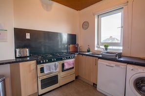 Kitchen with range style cooker