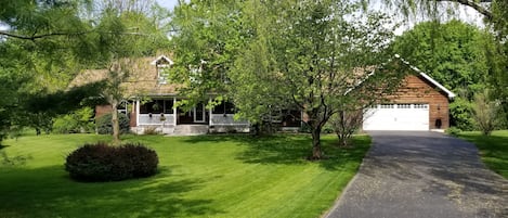 walking path to apartment is to the right of the garage door