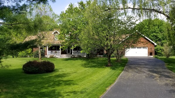 walking path to apartment is to the right of the garage door