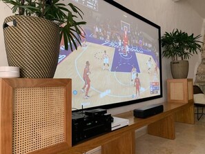 106" HD projector with PlayStation 5 and Bluetooth system.