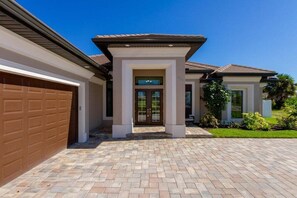 Side load garage and pavered driveway