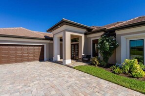 The property features lush landscaping