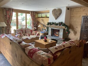Spacious lounge with open log fire 