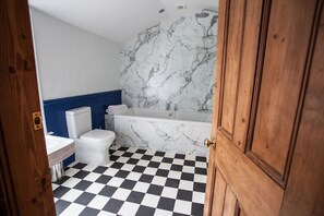 Large family bathroom - Over bath waterfall shower head and hand held shower head Large heated towel rail and WC and wash hand basin