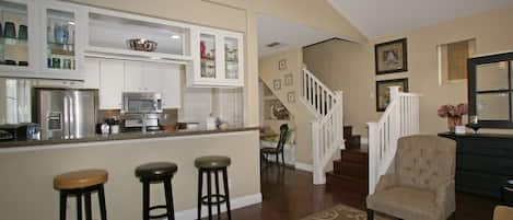 Welcome to The Cottage featuring an open floor plan with breakfast bar.