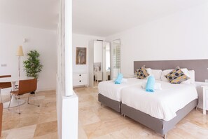 Bedroom and living room area well separated by a wall