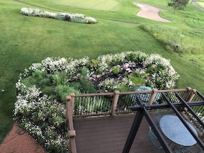 upper balcony view of deck and pond