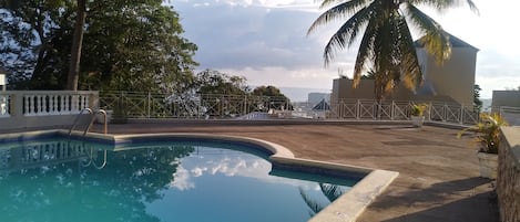 Catch some sun on the pool deck adjacent to the villa