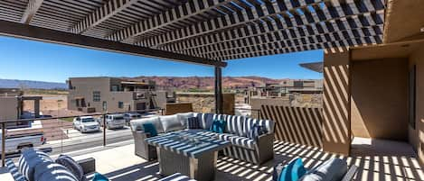 Upstairs Patio West View - The views from the upstairs patio are stunning.  You can enjoy majestic sandstone cliffs of Snow Canyon State Park directly from our home.