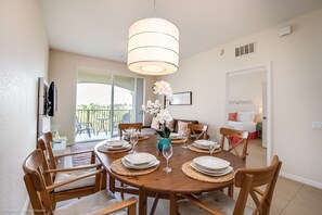 Dining in Style: Experience the epitome of elegance in our condo's dining area, adorned with sleek and sophisticated chairs for a luxurious dining experience