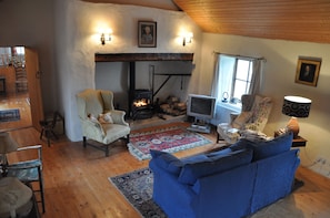 The living room - with fire place / wood stove.
