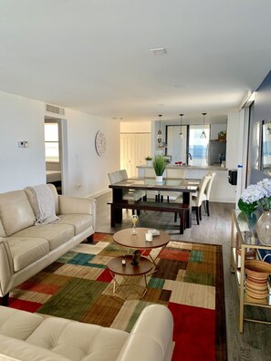 Open concept living, dining and kitchen area.